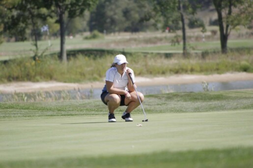 Liz playing golf